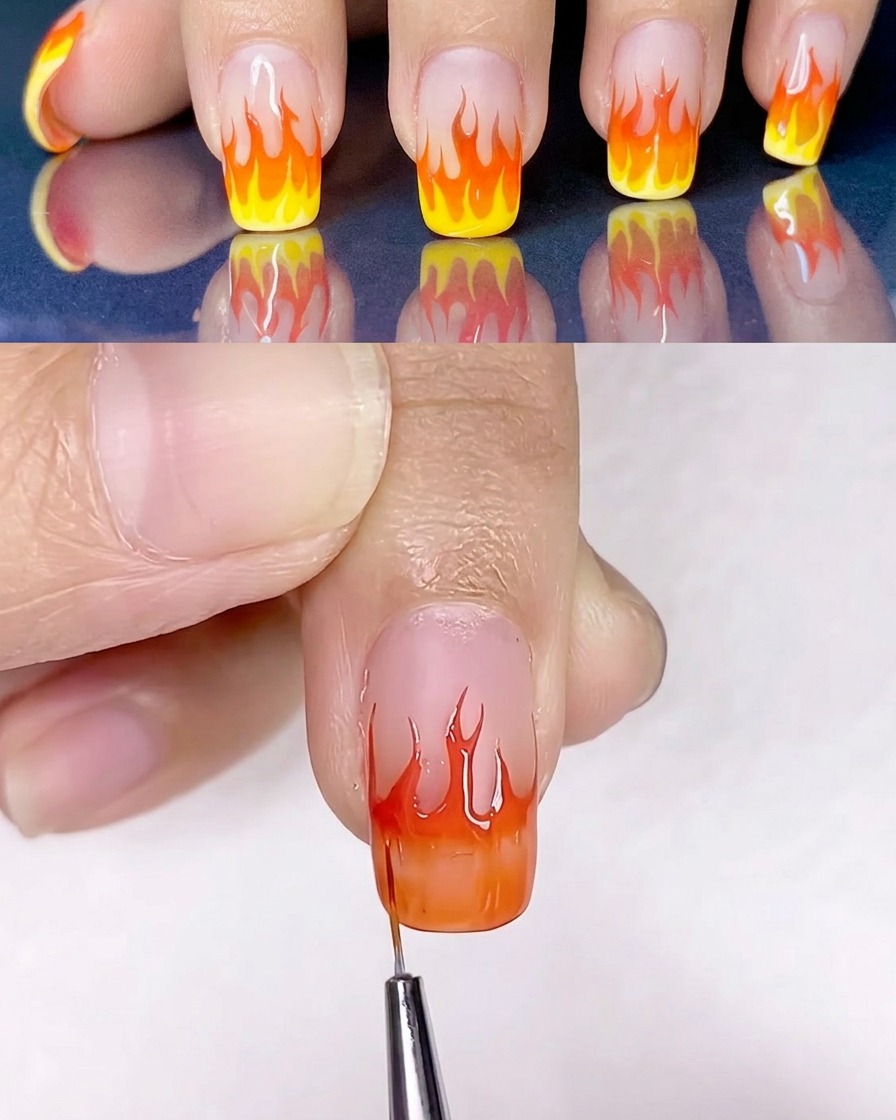 A flat brush blending yellow and orange gel polish on the nail surface.