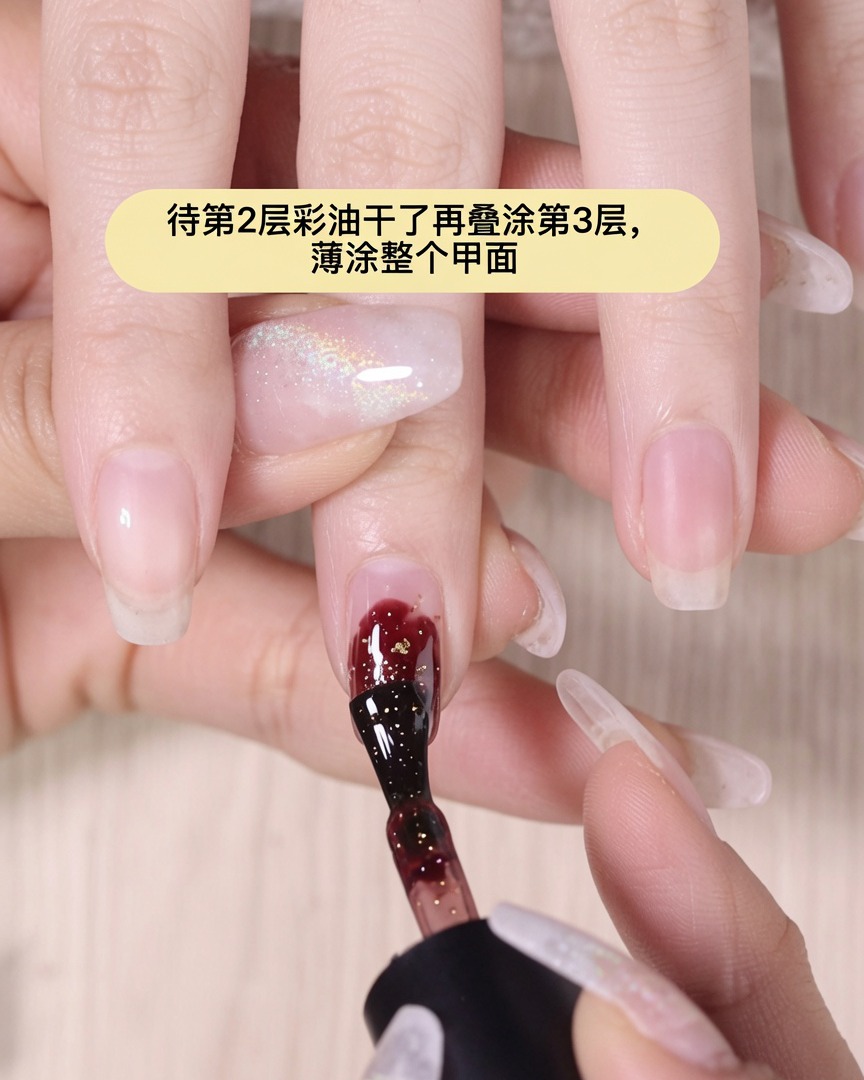 A close-up view of a brush applying a sheer red gel coat over the entire surface of the fingernail.
