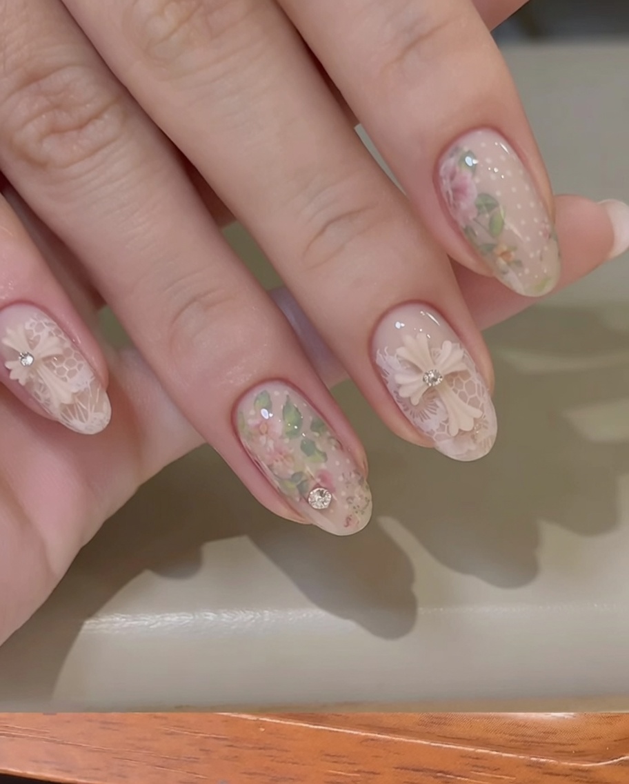 A small cleanup brush removing excess white stamping polish from the cuticle area of a fingernail.
