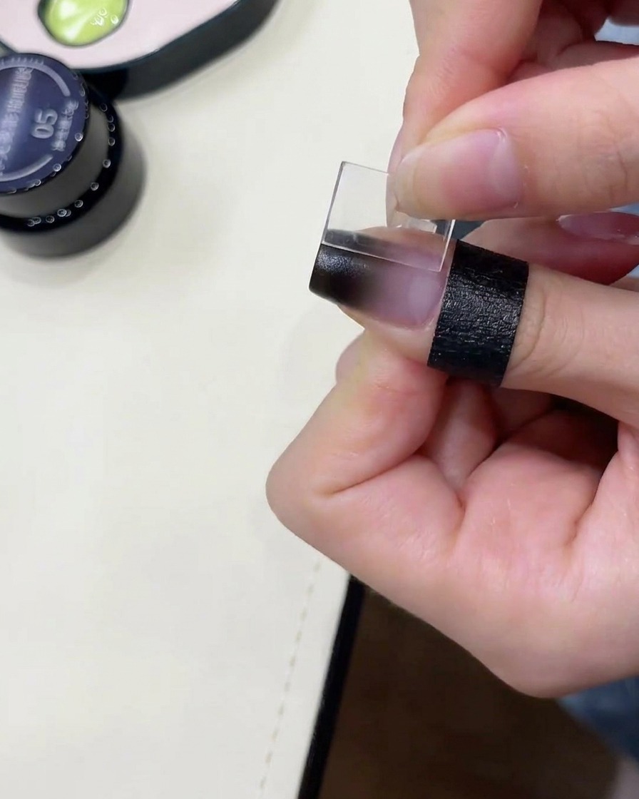 Applying cat-eye gel over the gradient.