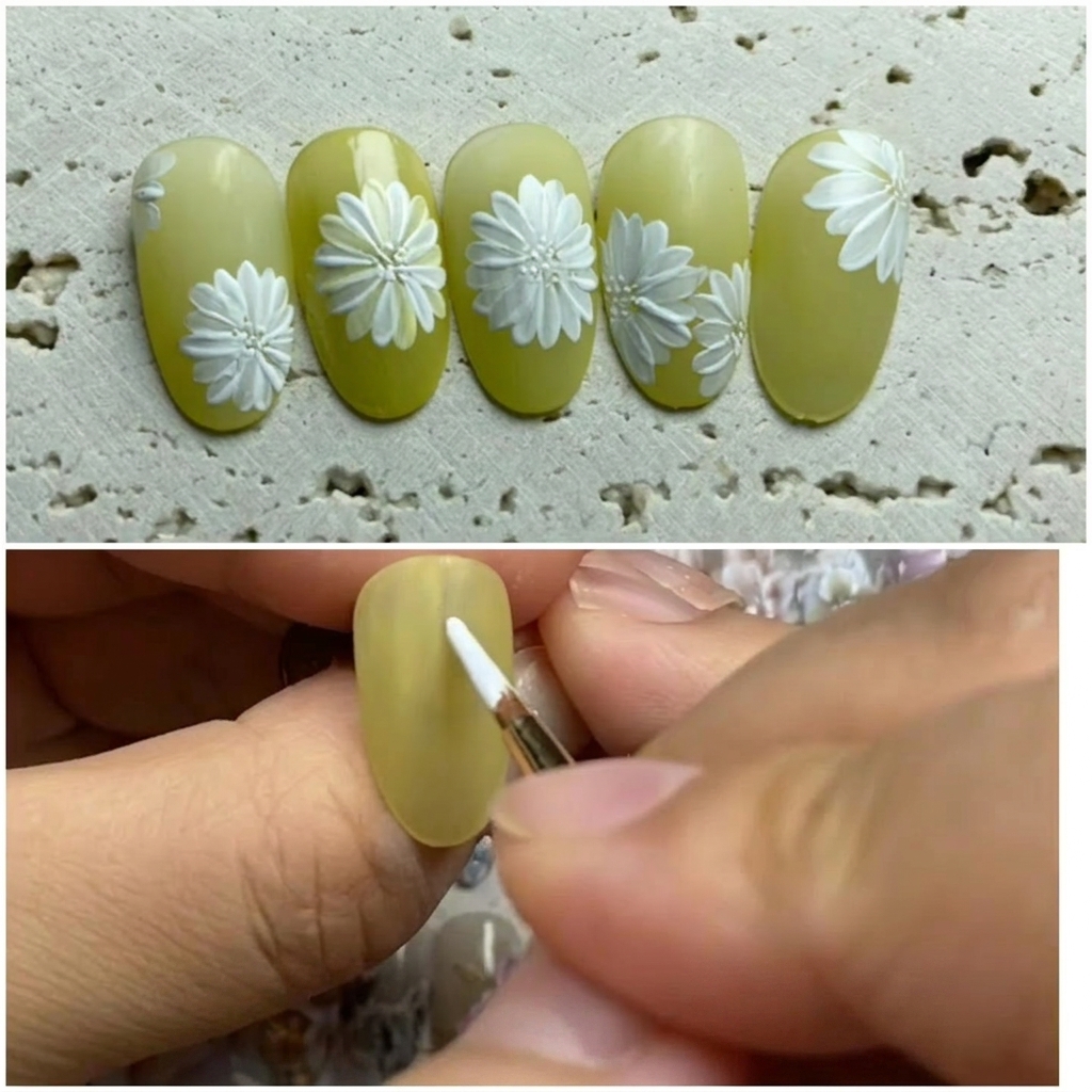 The eighth petal being added to complete the circular daisy formation on the nail.