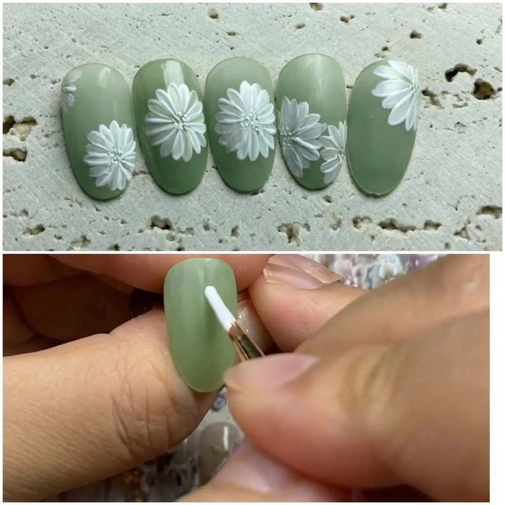 A close-up of a nail being decorated where a liner brush applies a small, precise dot of paint to the center of a white daisy.