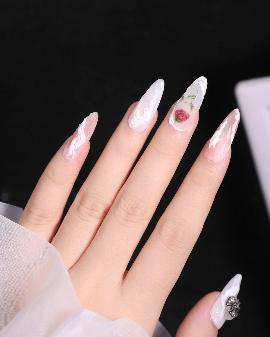 A close-up view showing a final white 3D gel line being drawn across the tip of the index fingernail.