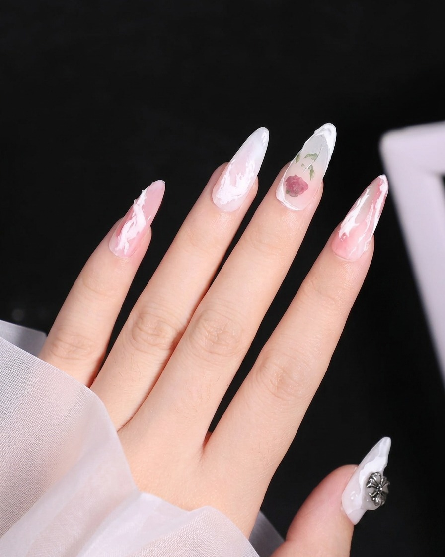 A close-up of a nail brush applying a raised, curved white line of 3D gel near the cuticle of the ring finger.