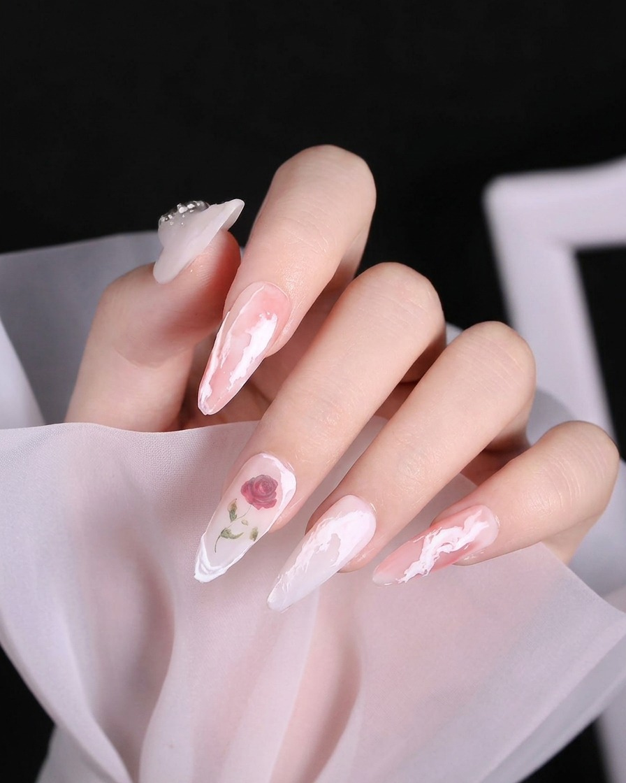 Macro shot of a nail with two intersecting raised white gel lines near the free edge of the ring finger.