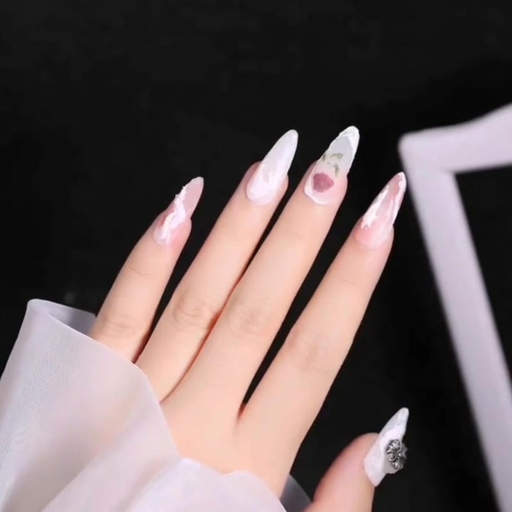 A close-up image showing a second 3D white curve being layered over the first one on a thumb nail.