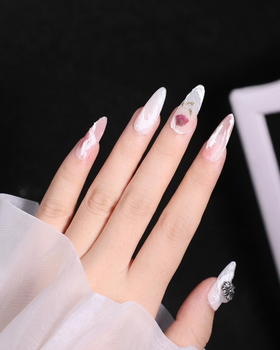 A close-up shot showing the matte top coat being applied to the rest of an index finger while avoiding the 3D textures.