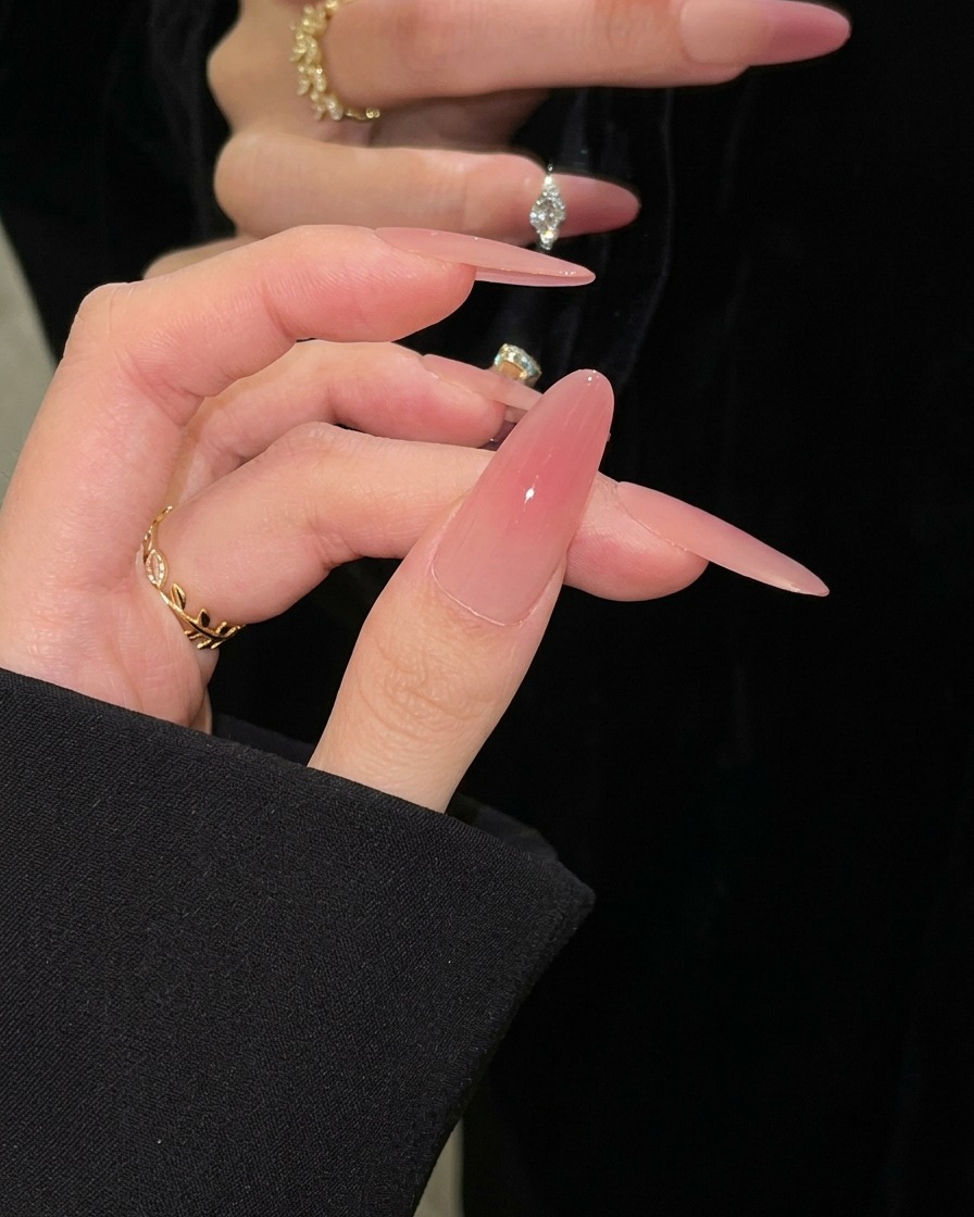 A hand resting inside an LED nail lamp with nails positioned for a final cure.