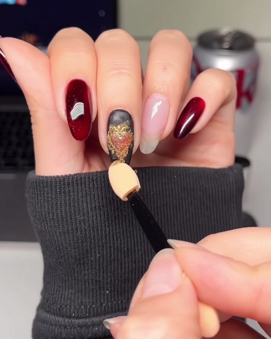 A hand applying a coat of solid white gel polish onto a bare fingernail.