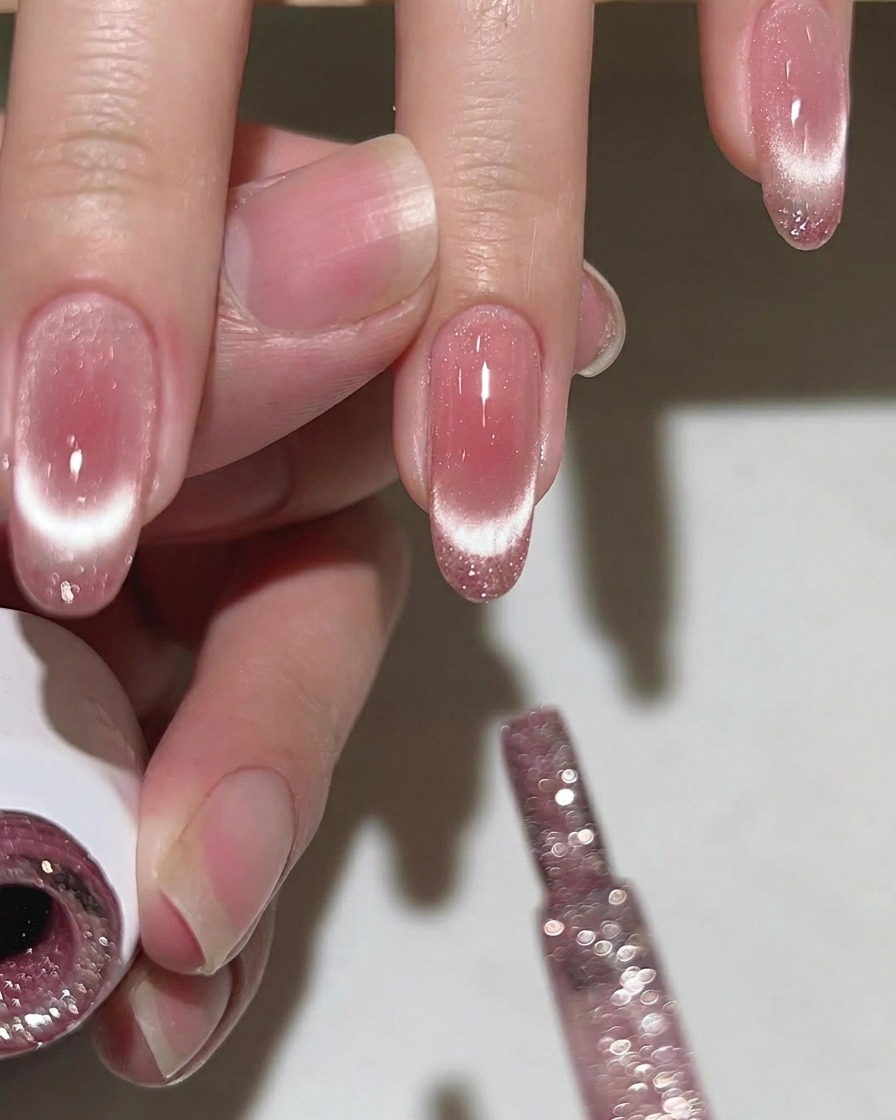 Close-up of a perfectly blended blush pink gradient on a fingernail.