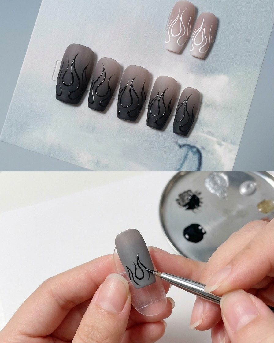 A fine liner brush drawing a curved black line representing the center of a flame on a matte nail.