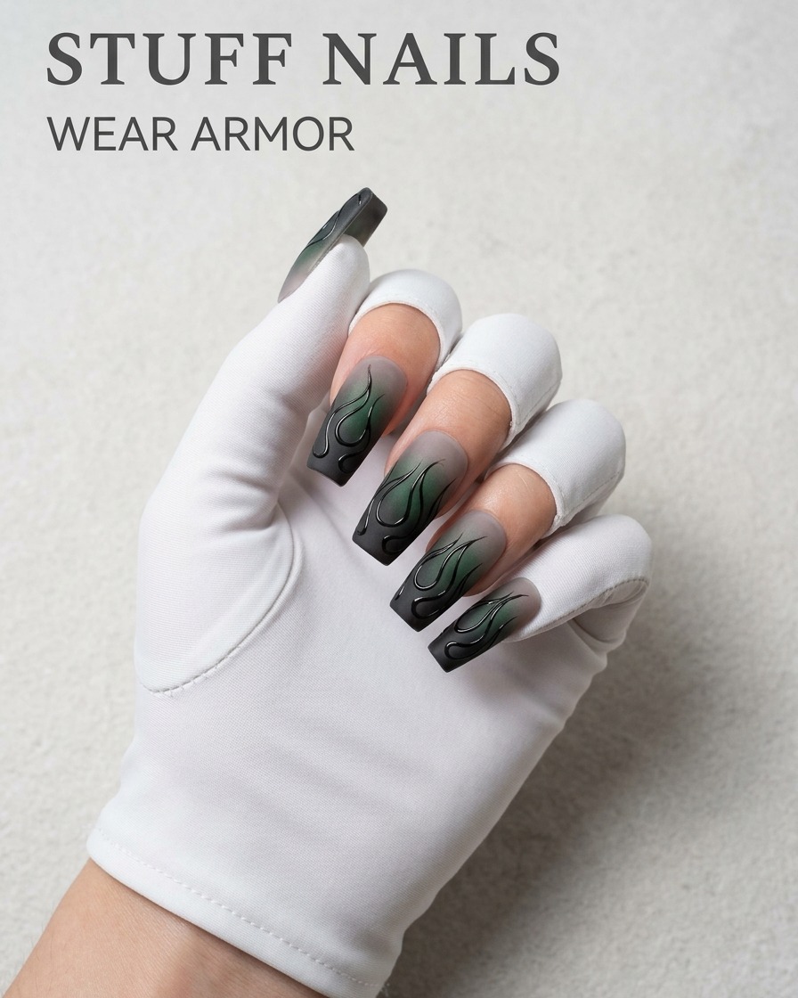 A detailed view of a liner brush applying extra gel to the outer edge of a flame design on a matte nail.