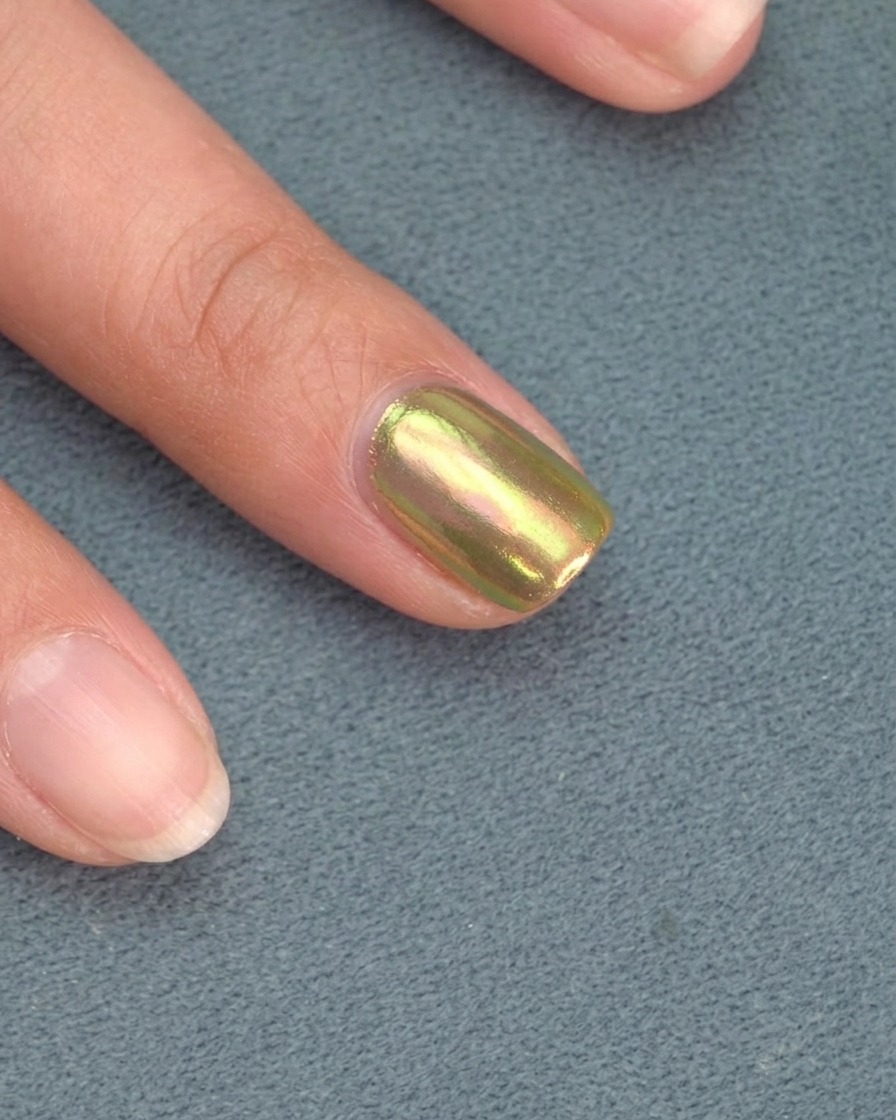 Nails resting under an LED lamp during the curing process.