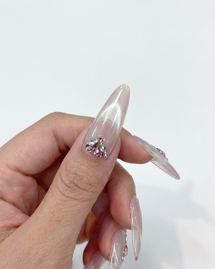 A close-up of a hand inside a nail curing lamp.