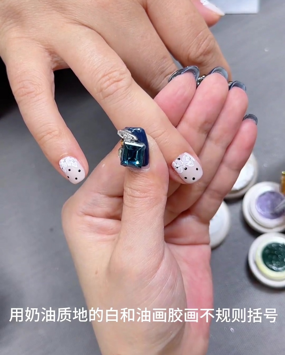 A detail brush adding small amounts of purple gel onto white rose petal shapes.