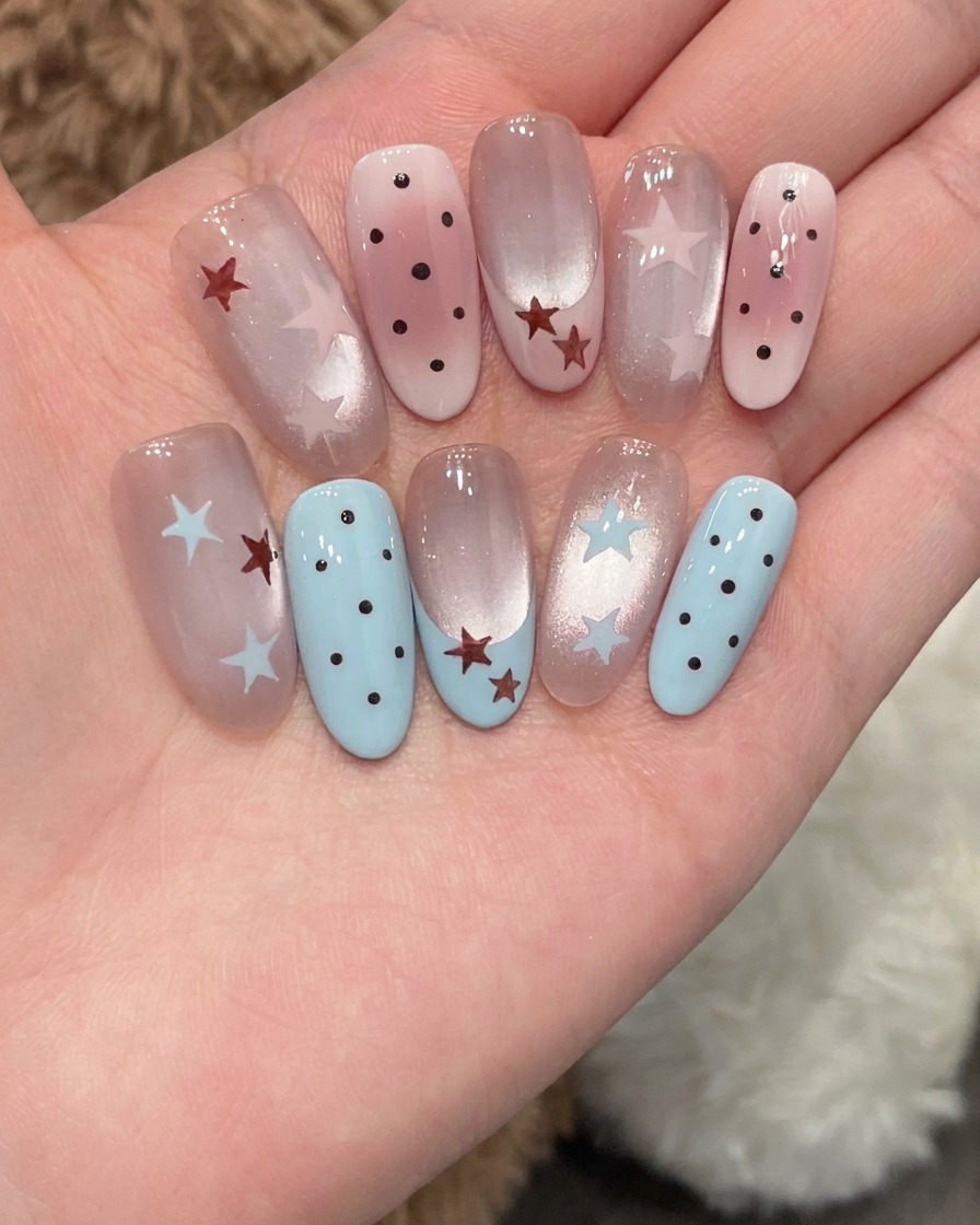 A thin liner brush applying blue gel to form a small star shape on the nail.