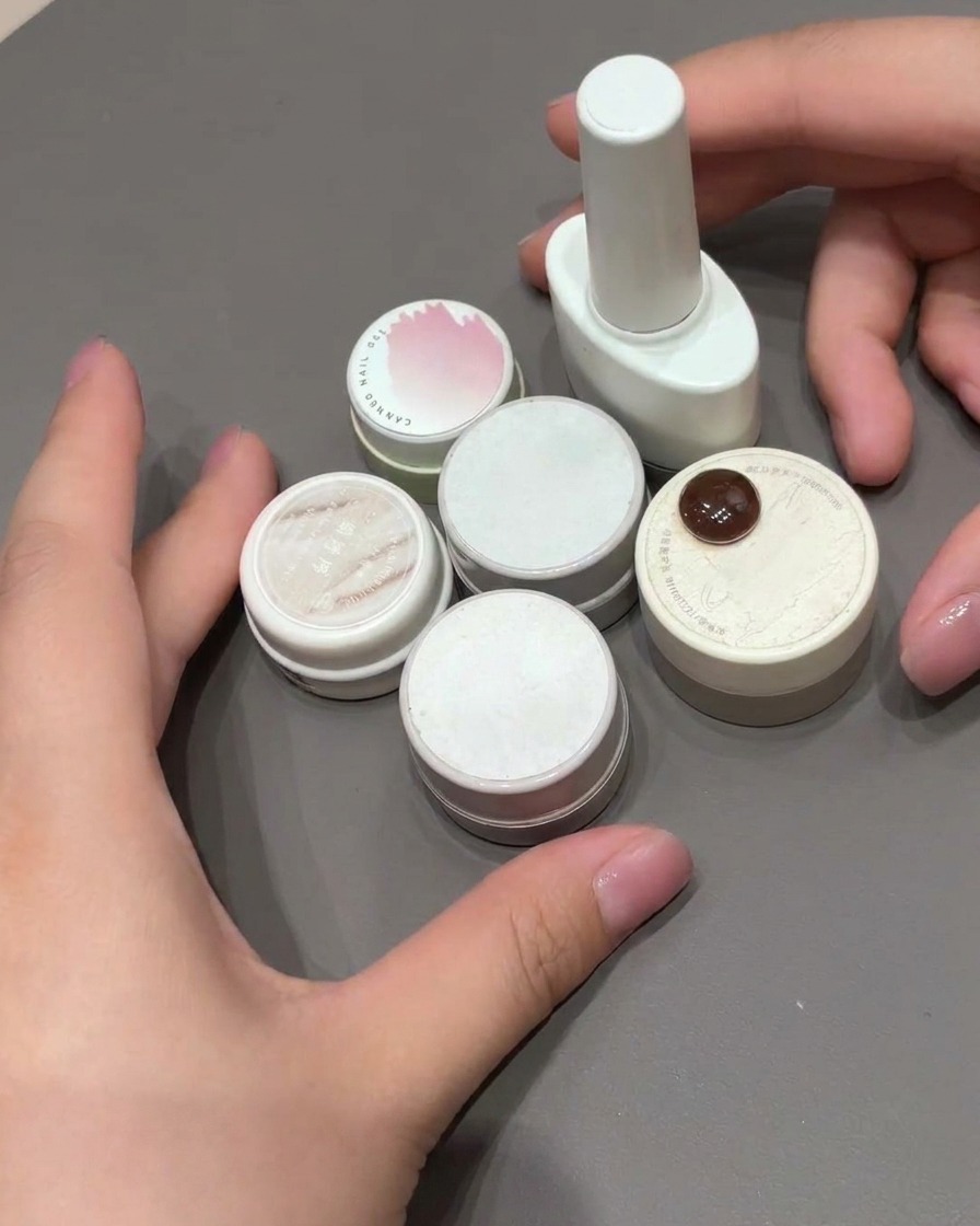 A close-up of a nail showing a soft pink blush-effect gradient created on a light base.
