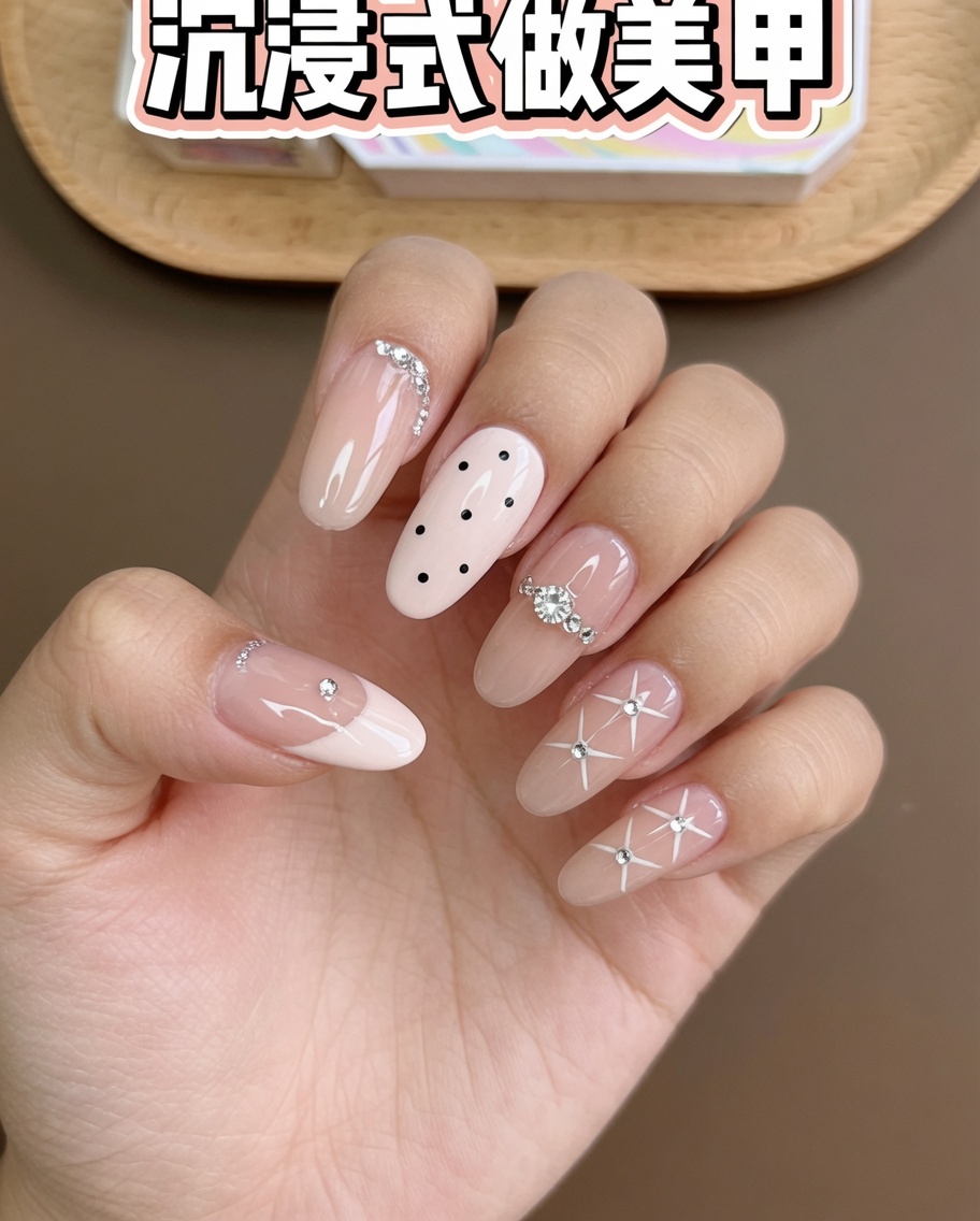 A pair of tweezers placing small steel beads and crystals on an index finger nail.