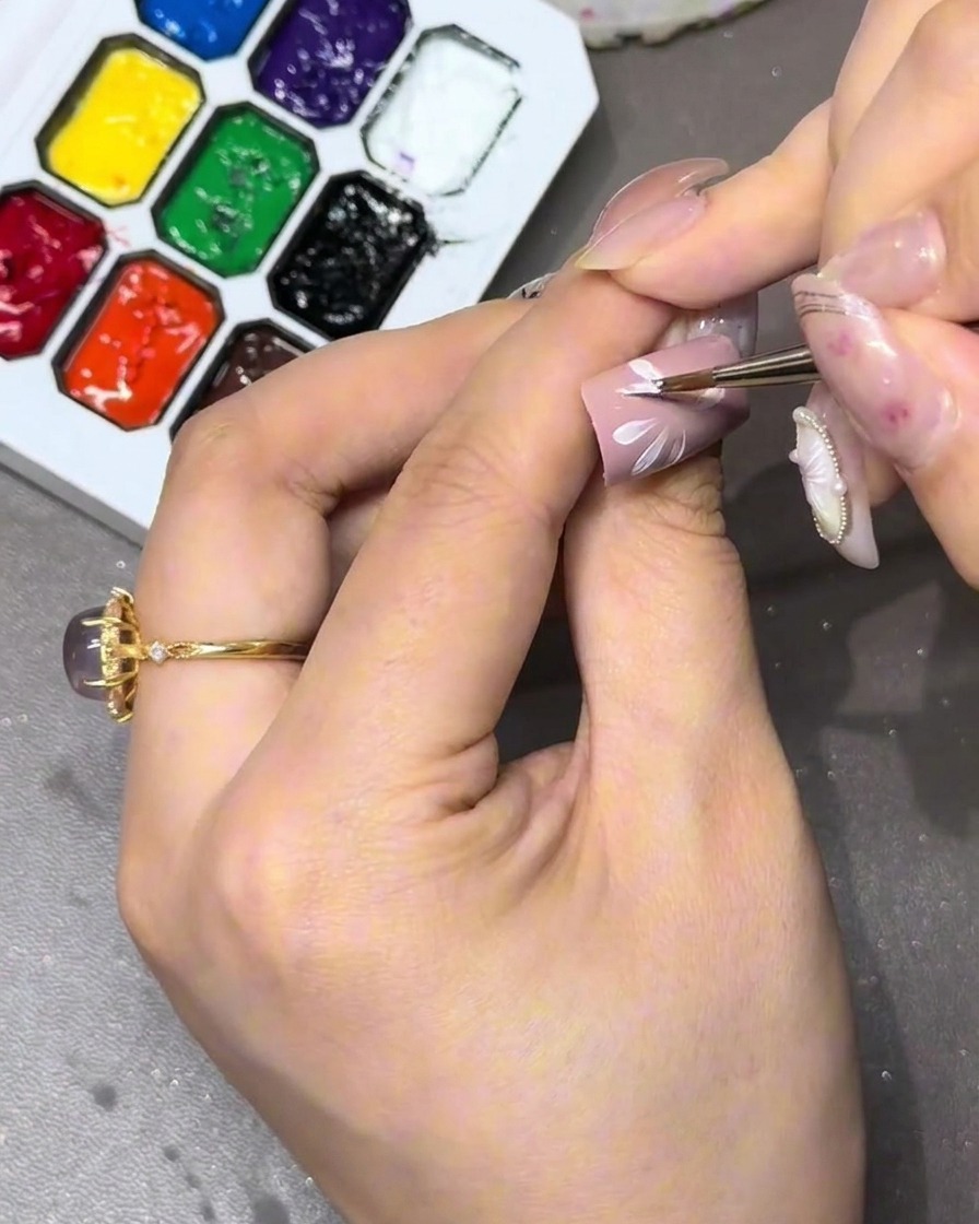 A close-up of the completed first layer of the flower, ensuring a uniform, round shape.