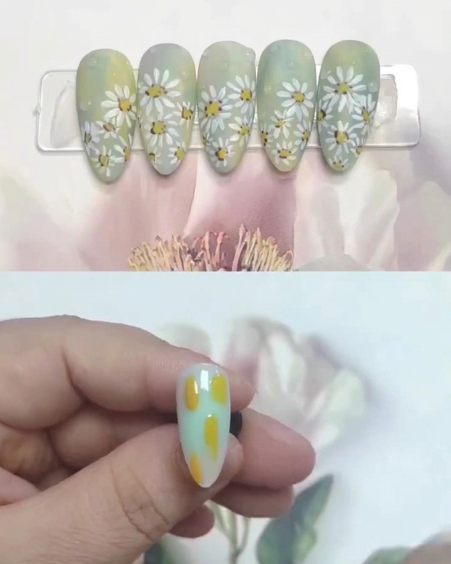 A small brush placing yellow gel dots on a blended background to mark flower locations.