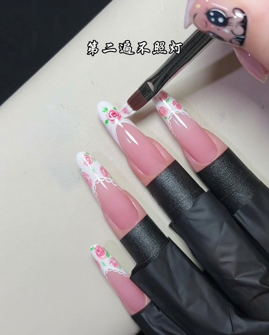 A professional nail brush applying a fresh, wet layer of textured white gel onto the tip of a nail.