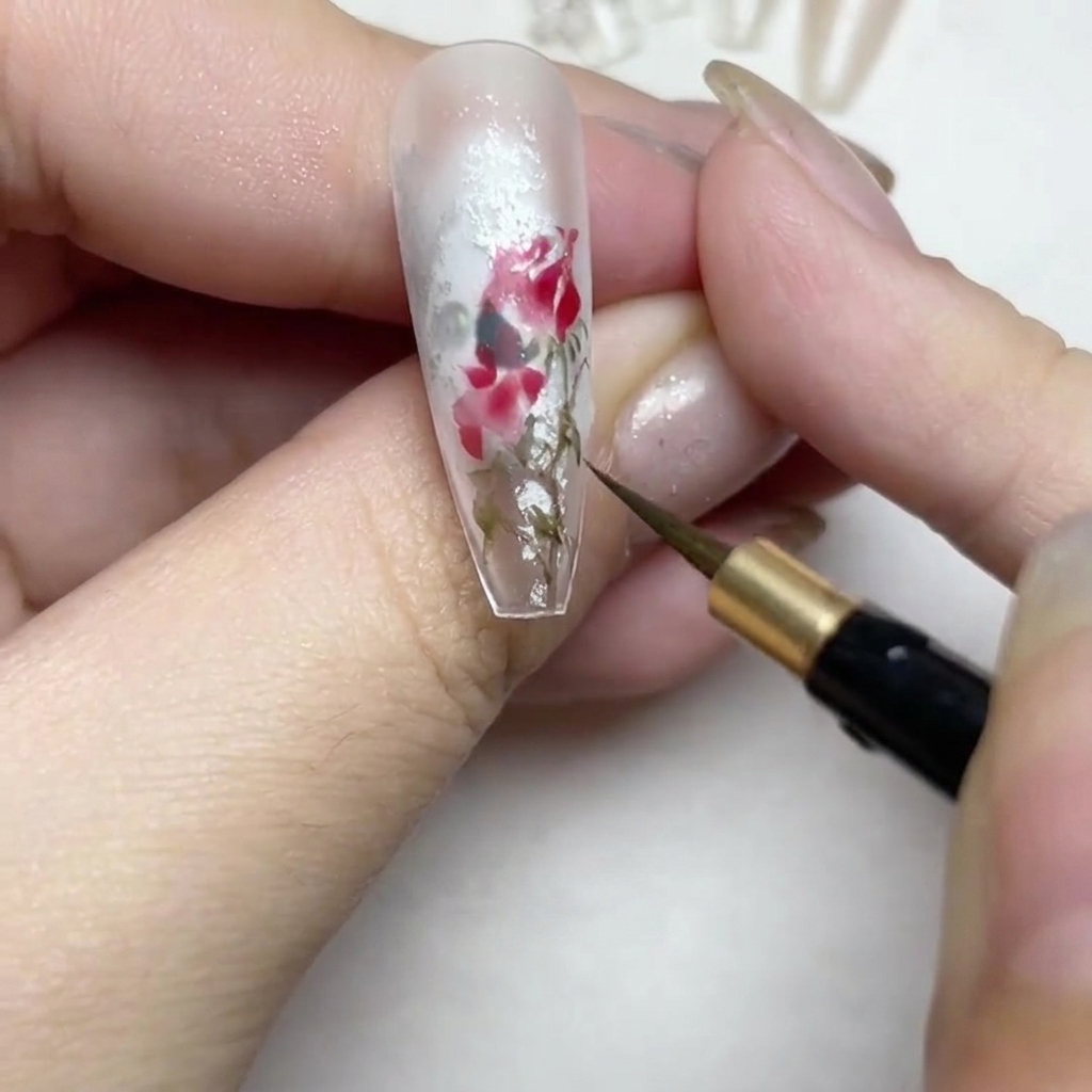 Detailing the edges of the rose design with thin white lace-pattern lines.