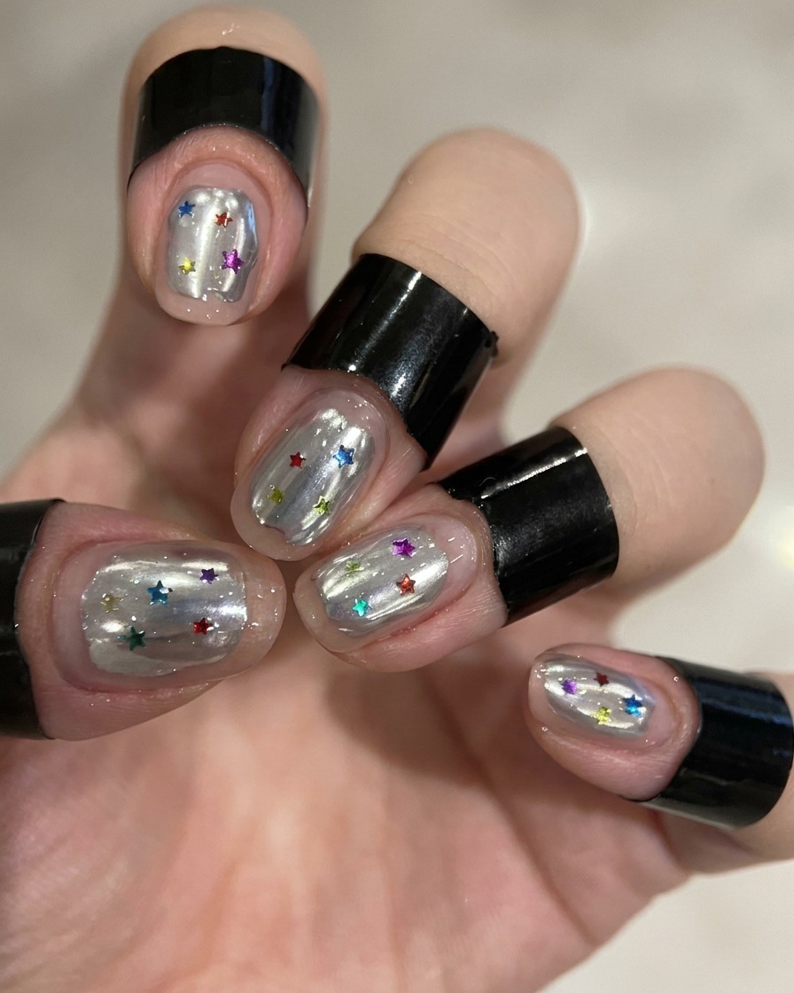 Nails with a white wave design curing inside a UV/LED lamp.