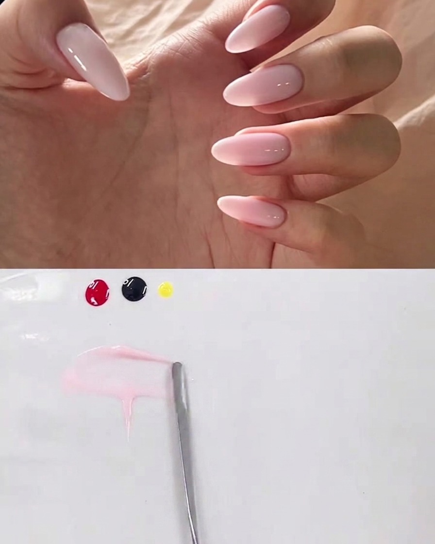 A tiny dot of black gel being added to the side of the pink gel mixture on the palette.
