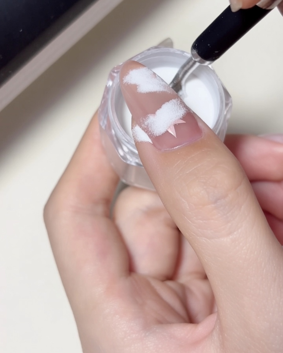 A close-up of a finger placed under a professional LED nail lamp, with the light illuminating the nail surface.