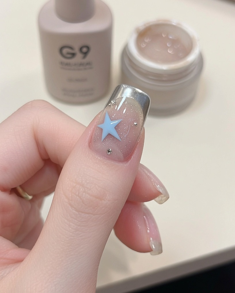 A close-up view of nails inside a UV nail lamp, during the final curing process.