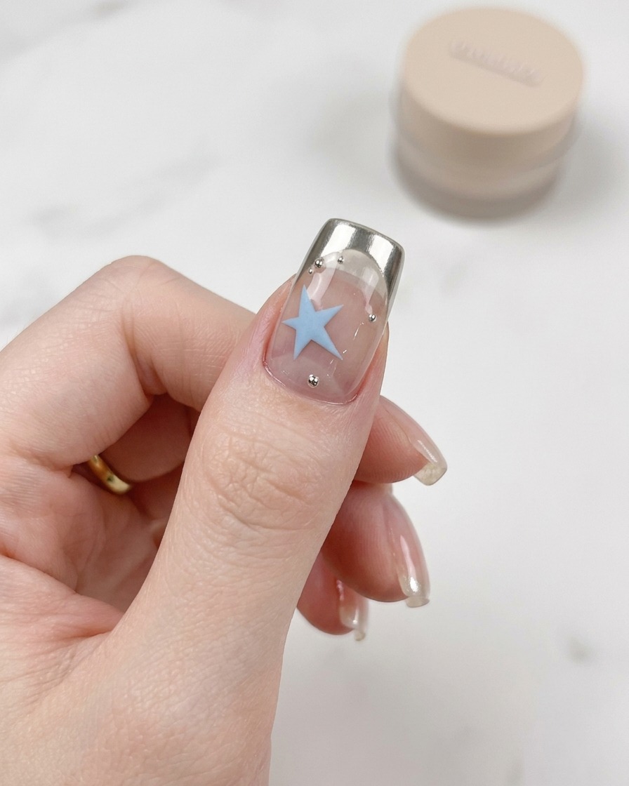 The nails positioned inside a professional UV/LED nail lamp for curing.