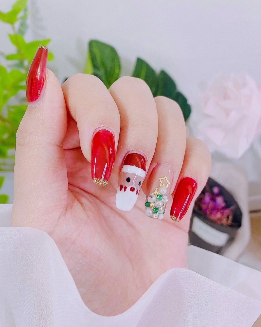 A close-up of a nail with vintage red gel applied to the top section, creating a clear border.