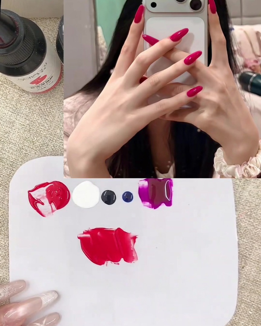 A metal spatula blending red and white gel together on a palette, transforming into a creamy pink shade.