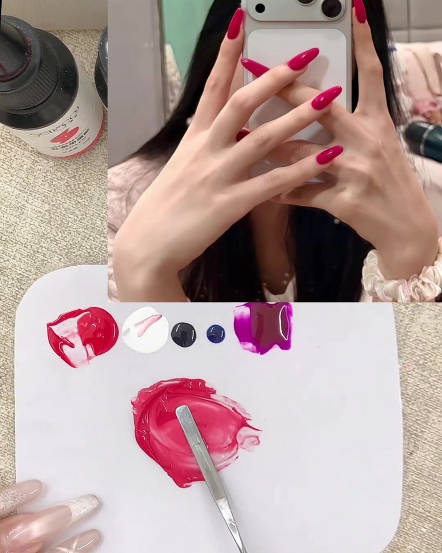 A small drop of deep purple gel being added to the existing pink gel mixture on the palette.