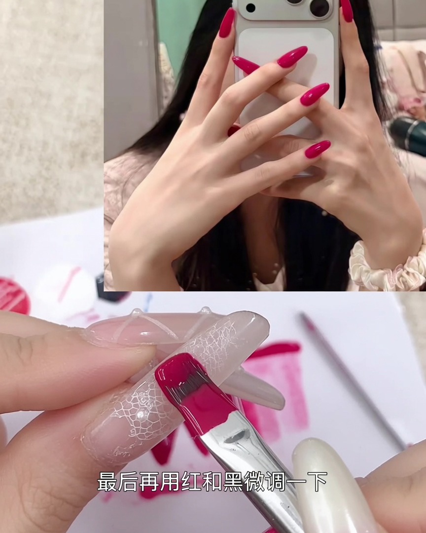 A nail brush applying a vibrant berry red gel onto a clear practice nail tip.
