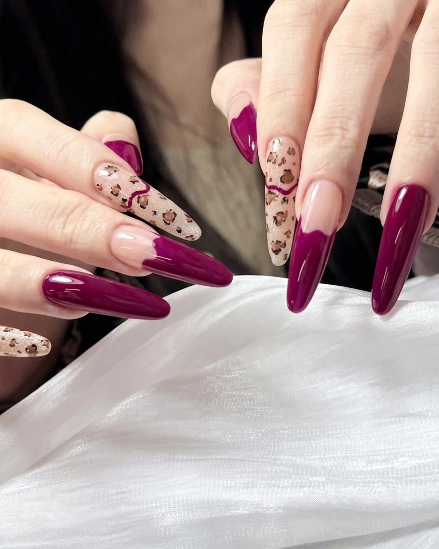A close-up of a fine nail art brush creating small, irregular brown spots on a nude-painted nail.