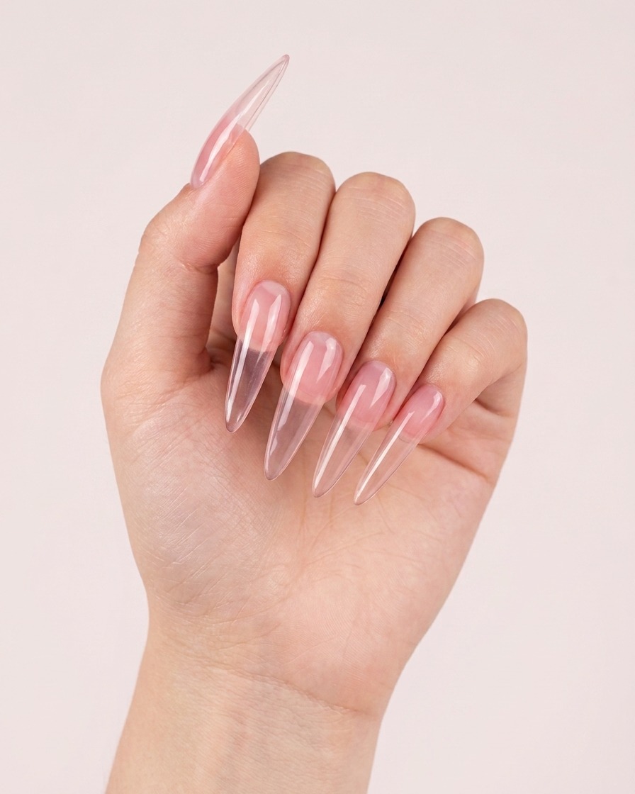 A layer of pink magnetic gel being applied to a nail, showing the shimmer starting to take effect.
