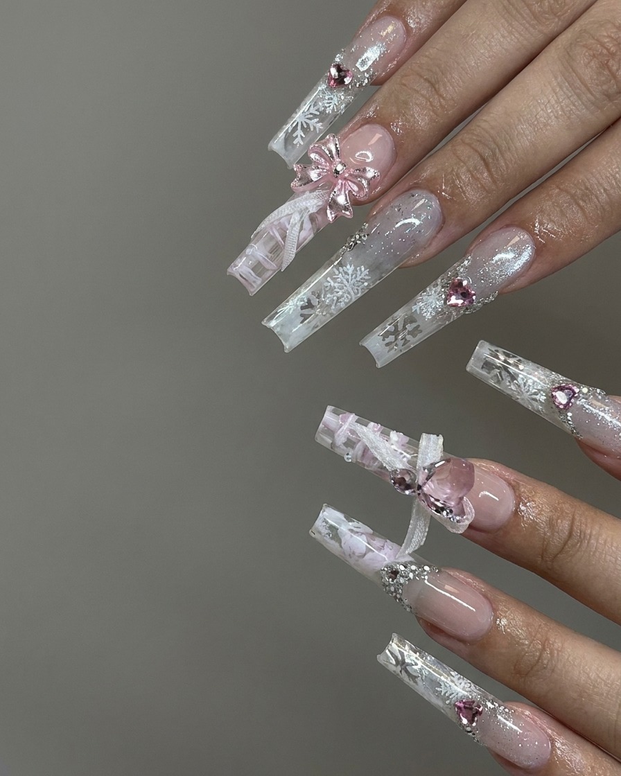 A close-up view of hands gently peeling white striping tape off a patterned nail to reveal crisp grid lines.