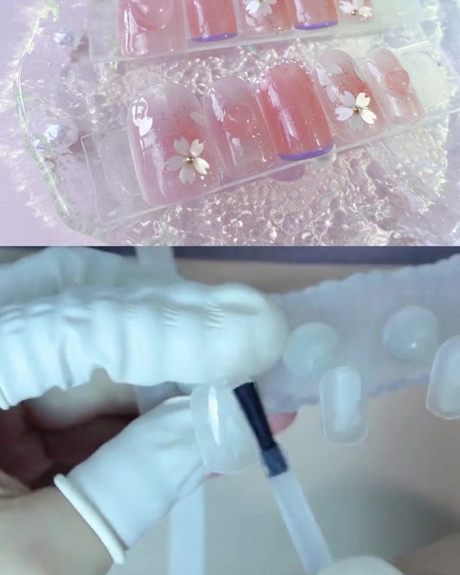 A nail stand positioned under a UV/LED nail lamp curing the base coat.