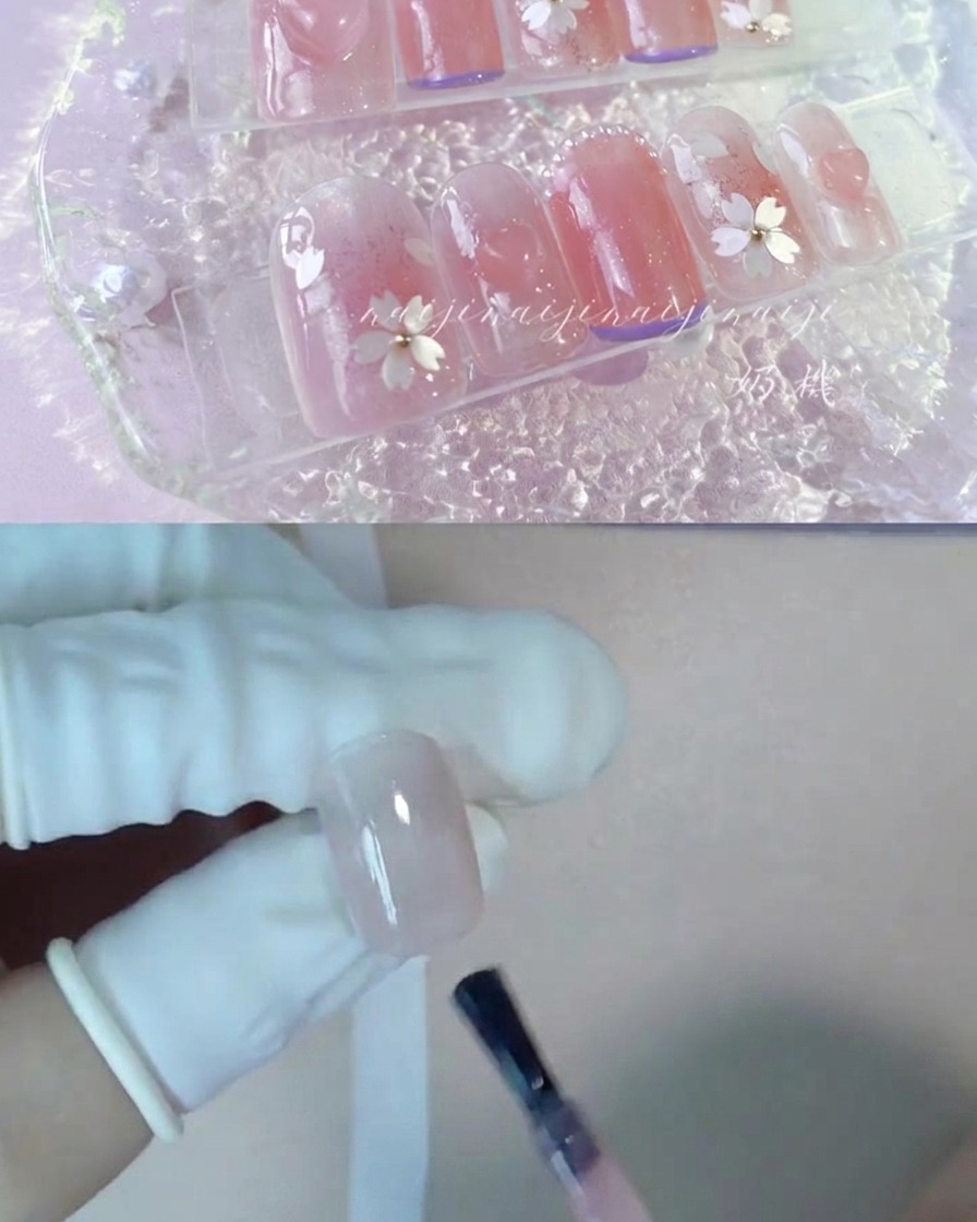 A brush applying nude peach color gel onto a thumb nail.