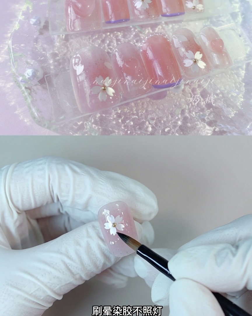 A brush applying clear blooming gel onto a nail surface without curing.