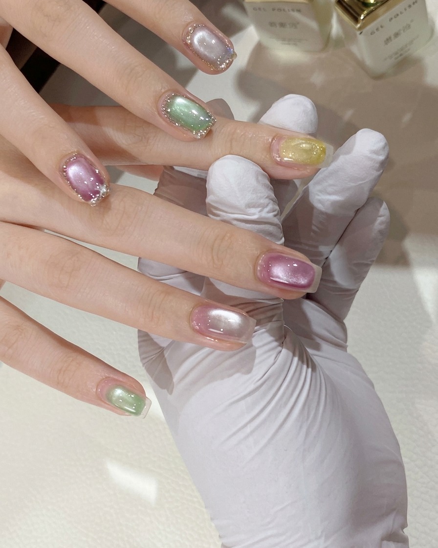 A spherical magnet held above a painted nail to concentrate the cat eye light.