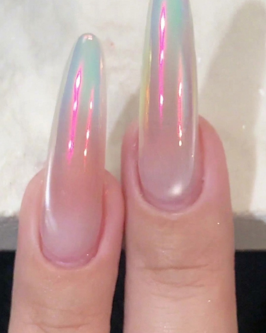 A close-up view of nails with white gel polish applied specifically to the tips.