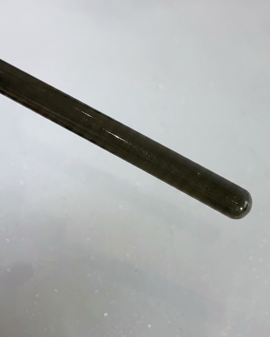 A close-up view of a Style Valley patting brush handle and tip.