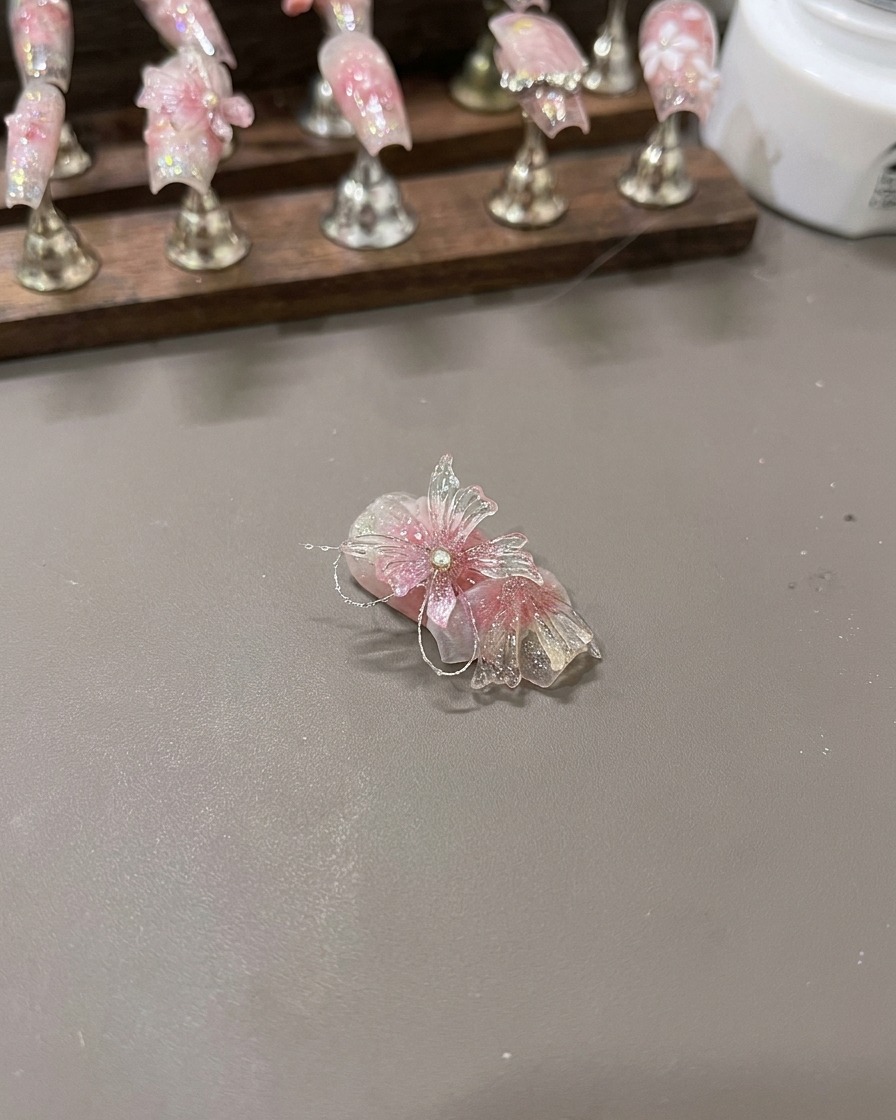 The completed 3D butterfly wings resting on a display surface prior to final nail placement.