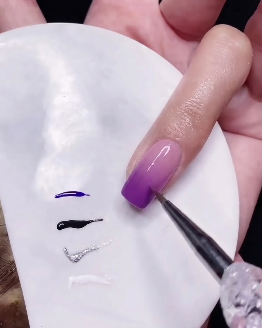 A fine liner brush adding horizontal intersecting white lines to form a woven tweed pattern on the nail.