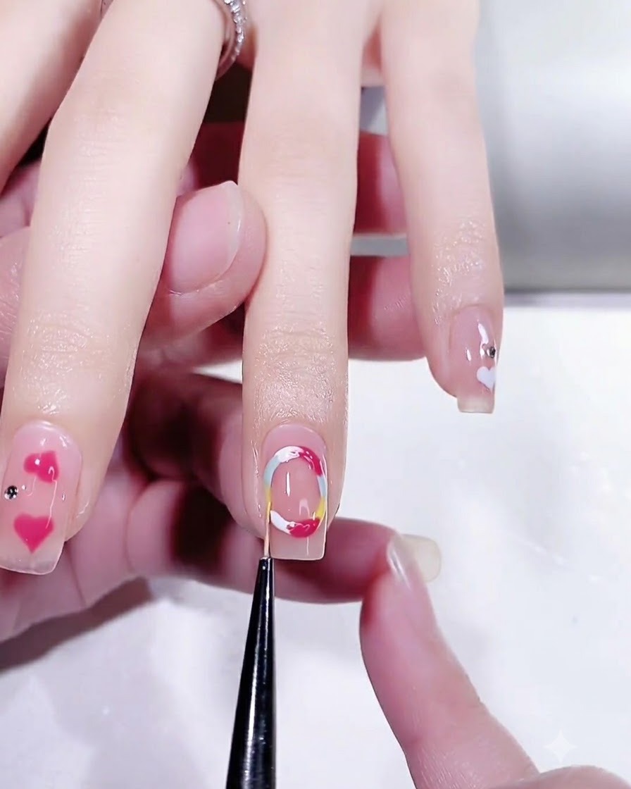 A detail brush scooping clear semi-solid modeling gel from an open jar.