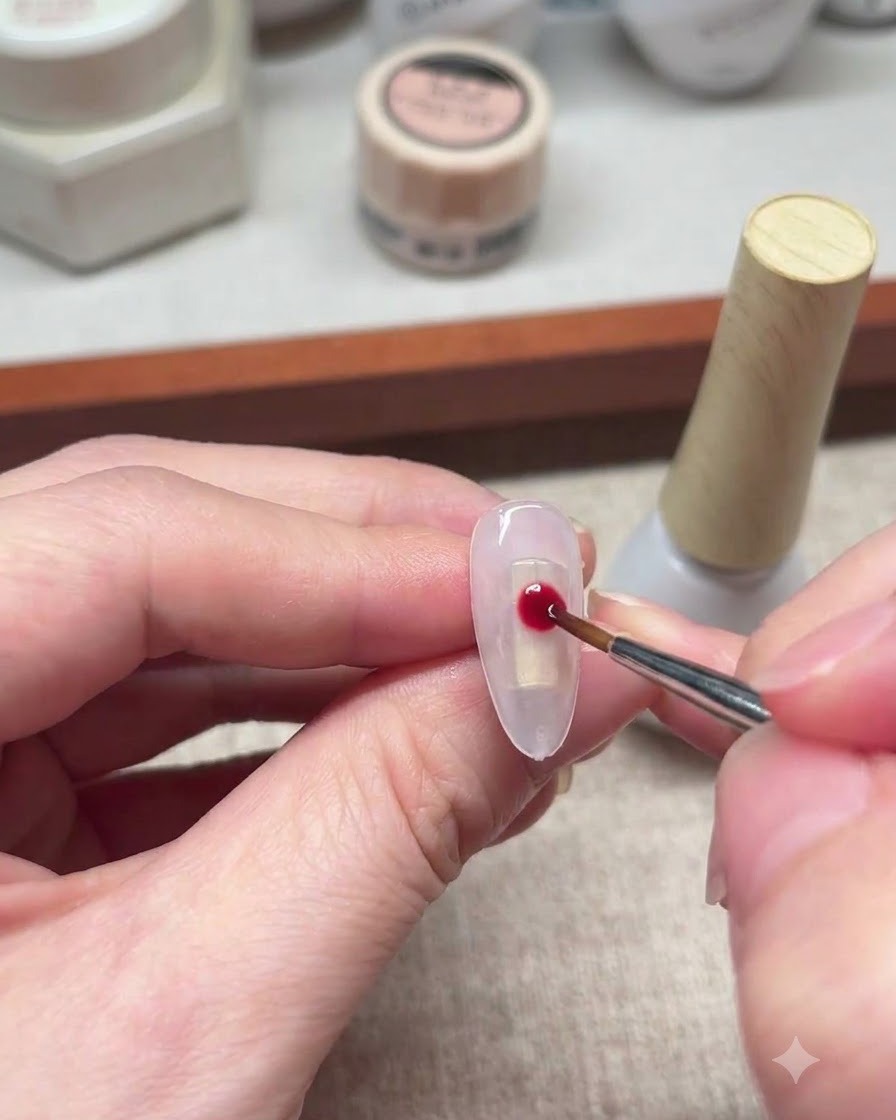 A fine liner brush dipping into white gel polish.