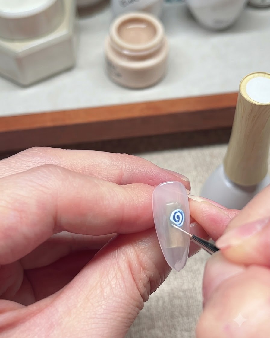 A close-up view of a fine liner brush detailing and refining the white petals of the blue rose nail art.