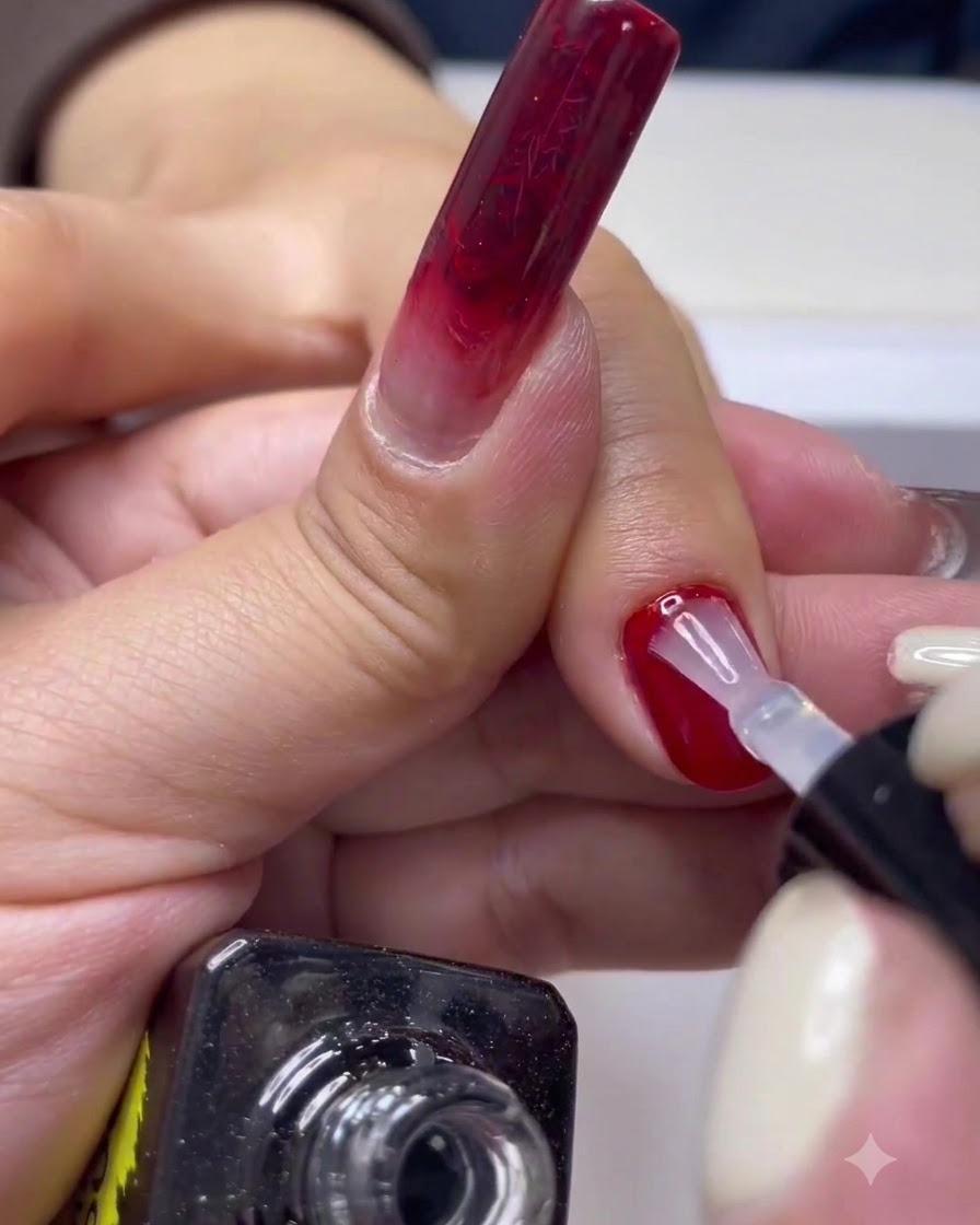 A hand resting inside a professional UV/LED nail curing lamp.